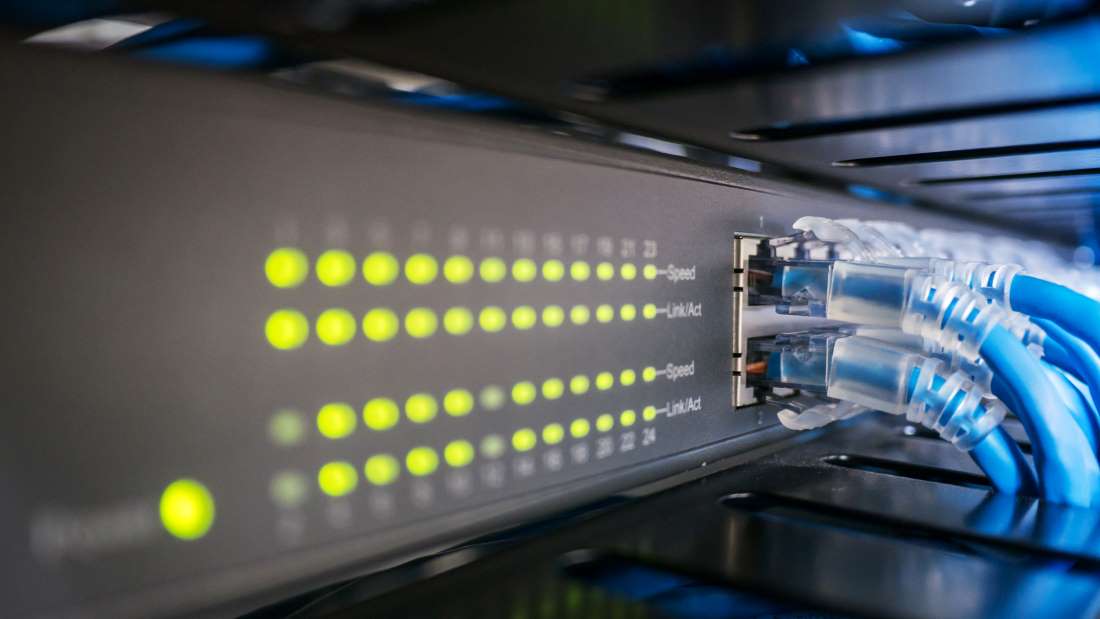 A POPP Managed Ethernet Switch distributes internet bandwidth to computers and IP Phones on a Cloud PBX in an Edina, MN business